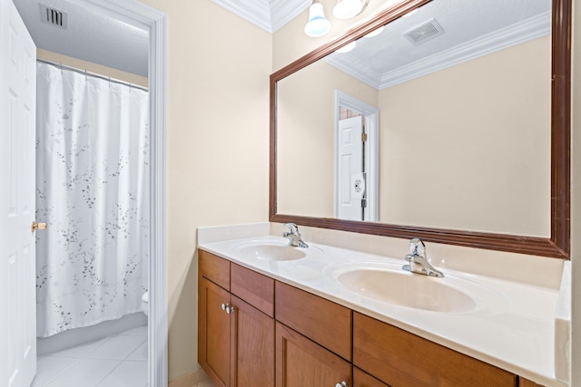 bathroom with ornamental molding, a shower with curtain, vanity, a textured ceiling, and tile patterned flooring