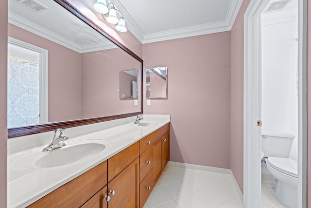 bathroom featuring tile patterned floors, toilet, ornamental molding, and a textured ceiling