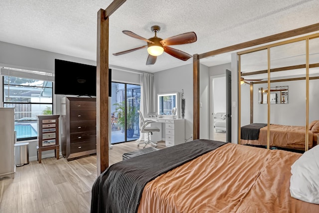 bedroom with ceiling fan, access to exterior, light wood-type flooring, and a textured ceiling