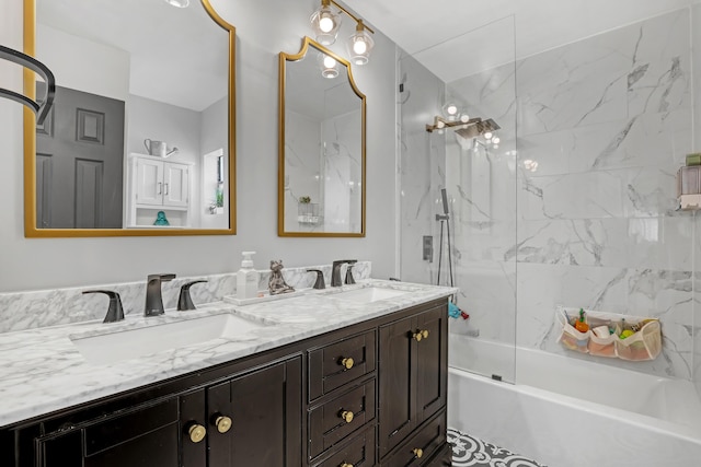 bathroom featuring vanity and tiled shower / bath