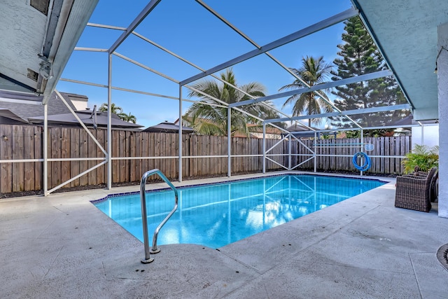 view of pool featuring a lanai and a patio