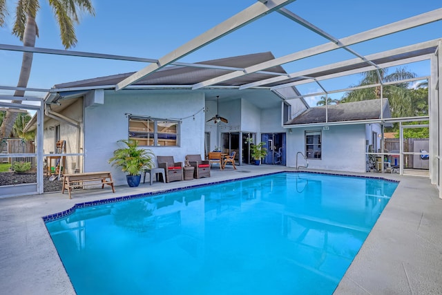 view of swimming pool featuring a patio and a lanai