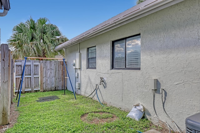 view of side of home featuring a yard