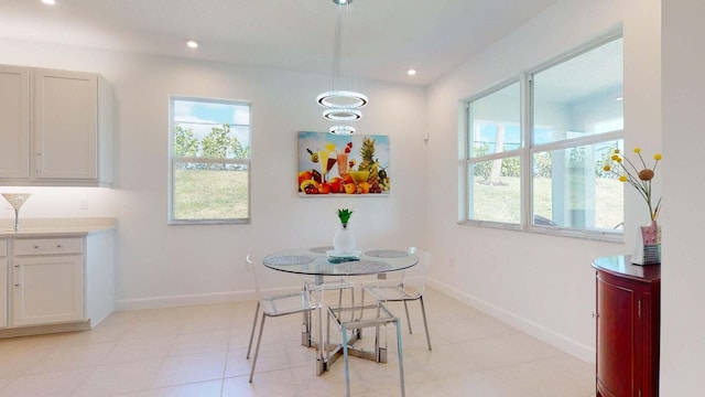 dining area featuring light tile patterned flooring