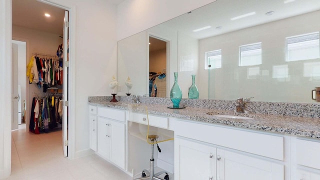 bathroom with tile patterned floors and vanity