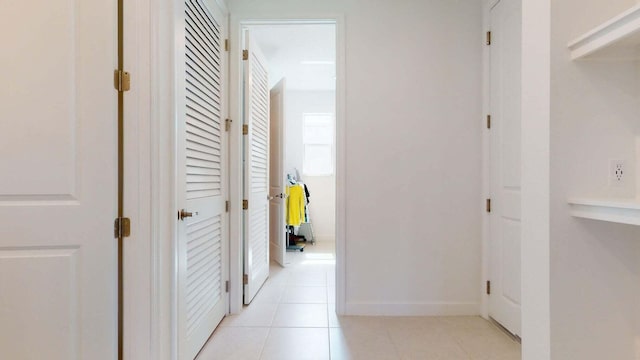 corridor with light tile patterned floors