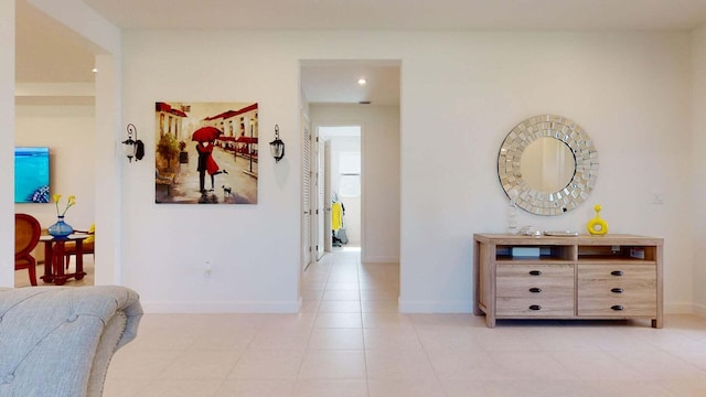 hall featuring light tile patterned floors