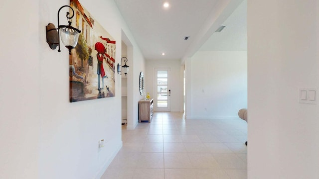 hallway featuring light tile patterned floors