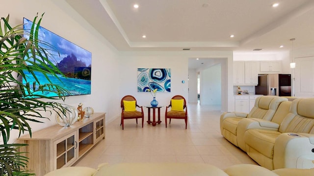 living room with a tray ceiling