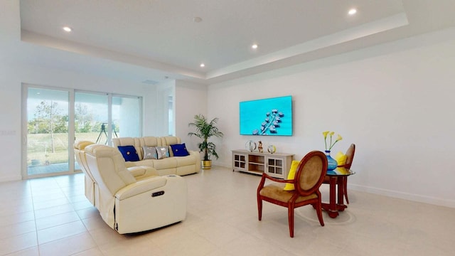 living room with a raised ceiling