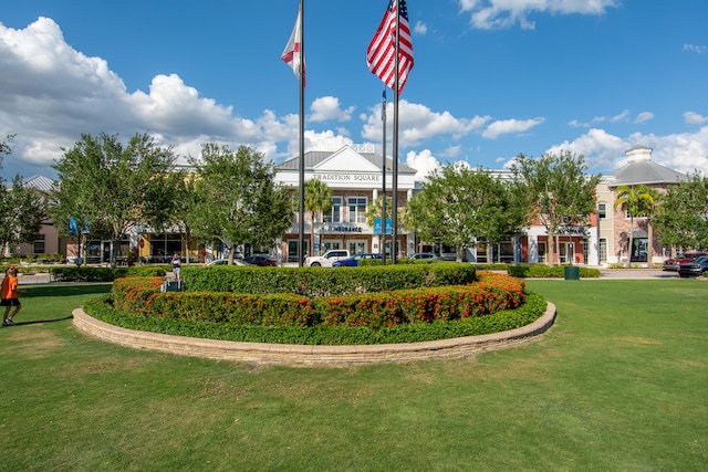 view of property's community with a lawn