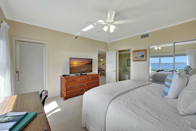 bedroom with ensuite bath, ceiling fan, crown molding, light colored carpet, and access to outside