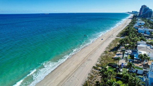 bird's eye view featuring a view of the beach and a water view