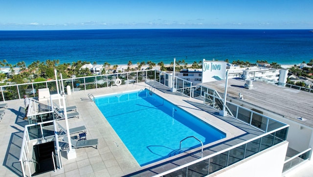 view of pool featuring a water view