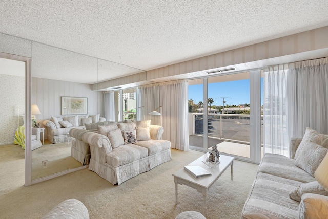 carpeted living room featuring a textured ceiling