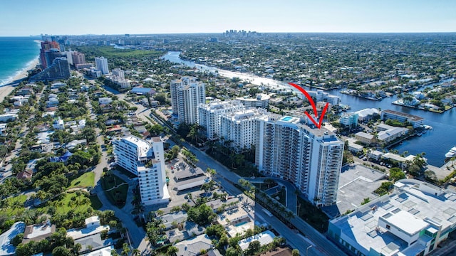 birds eye view of property with a water view