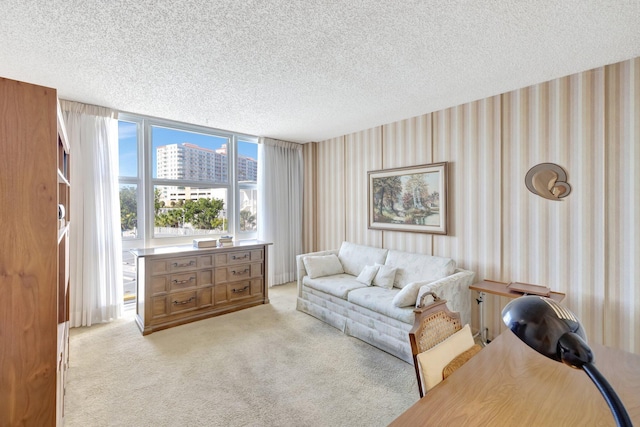 carpeted living room featuring a textured ceiling