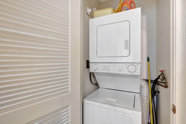 laundry area with stacked washer and clothes dryer