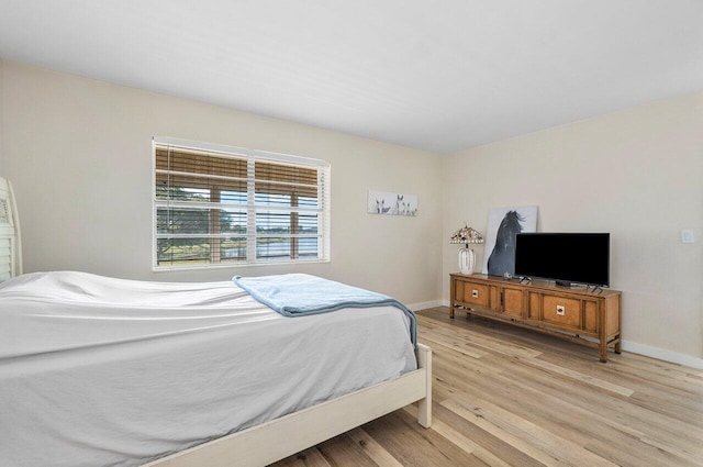 bedroom featuring light wood-type flooring