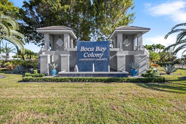 community / neighborhood sign with a lawn