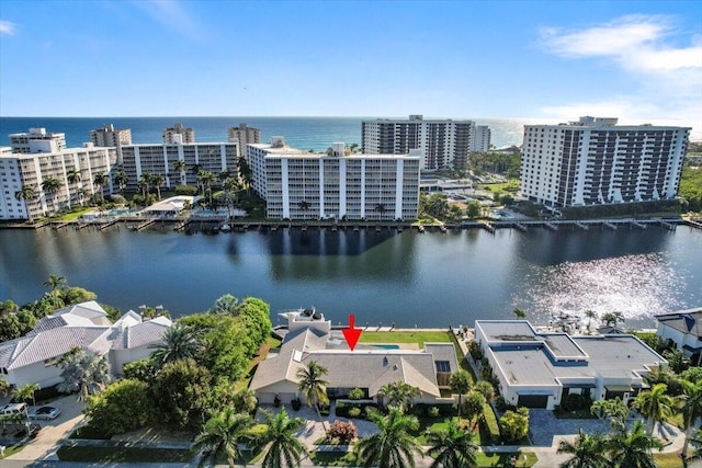 birds eye view of property with a water view