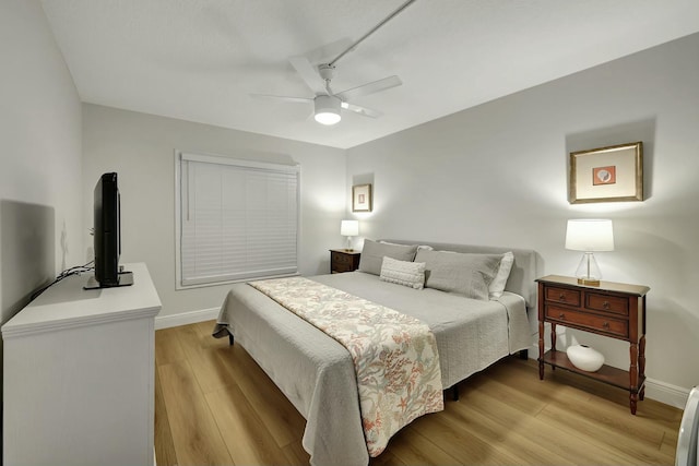 bedroom featuring ceiling fan and light hardwood / wood-style floors