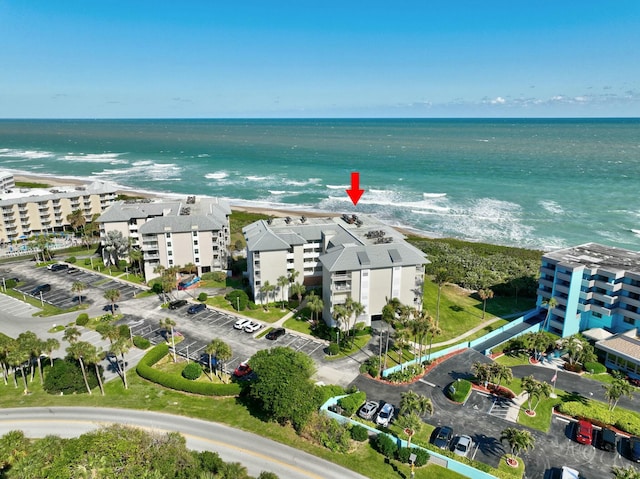 aerial view featuring a water view and a view of the beach