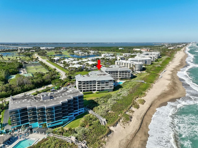 drone / aerial view featuring a view of the beach and a water view