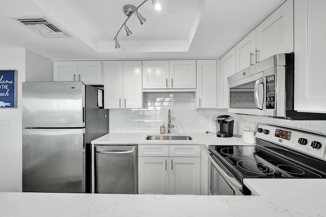 kitchen with white cabinetry and stainless steel appliances