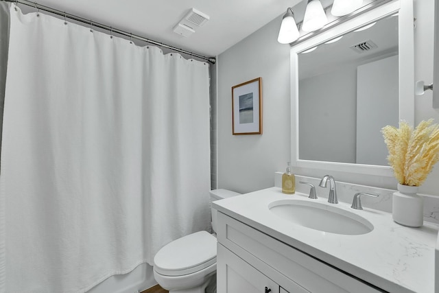 full bathroom with vanity, toilet, and shower / bath combo