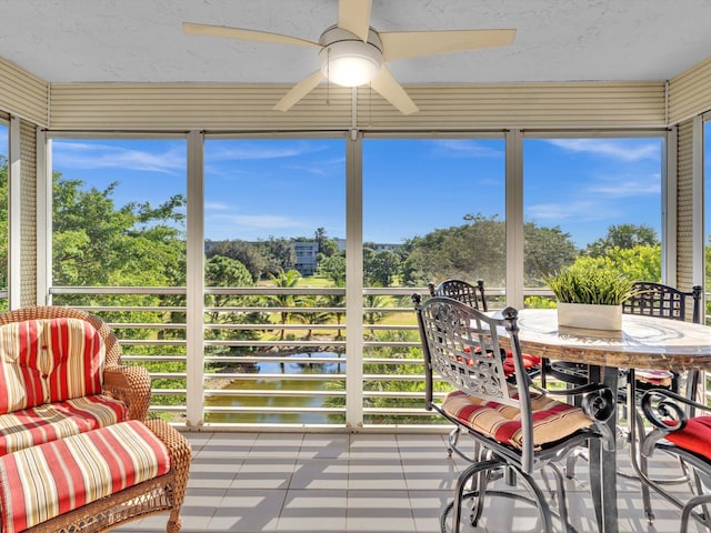 sunroom / solarium with plenty of natural light and ceiling fan