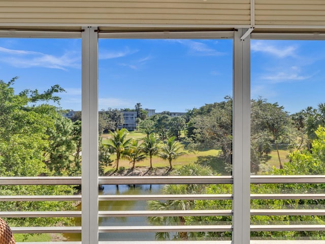 interior space featuring a water view and a healthy amount of sunlight