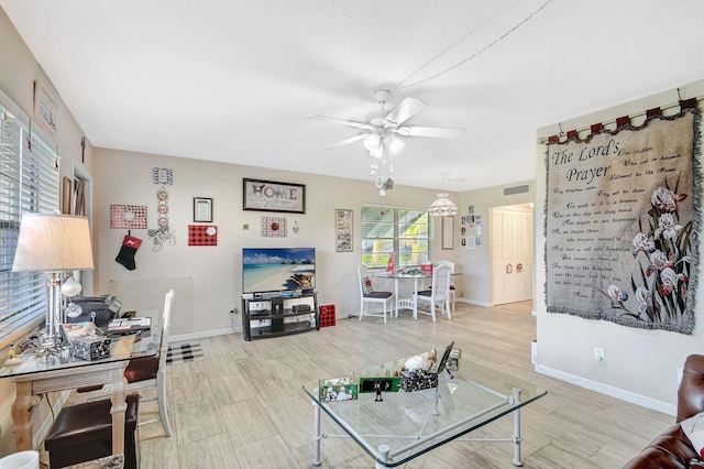 living room with light wood-type flooring and ceiling fan