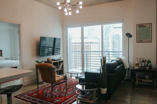 living room featuring concrete flooring, a wealth of natural light, and an inviting chandelier