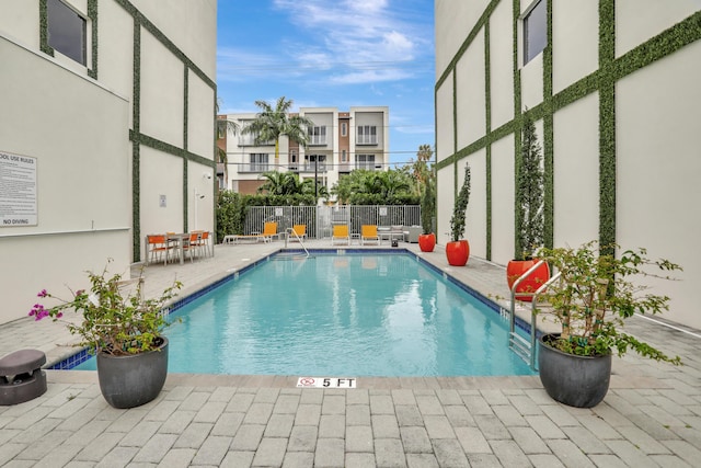 view of pool featuring a patio