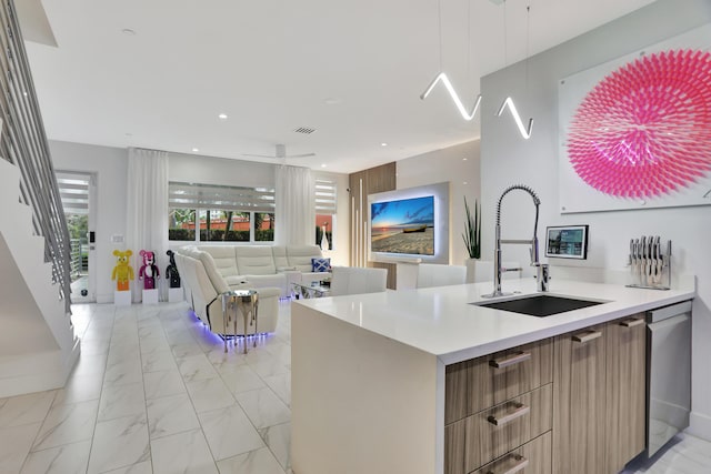 kitchen featuring stainless steel dishwasher and sink