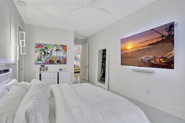 bedroom with ceiling fan and a closet