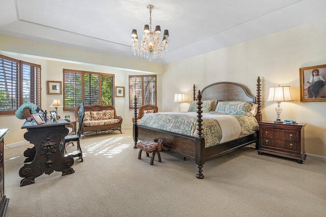 bedroom featuring a notable chandelier and carpet floors