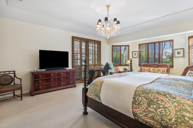 bedroom featuring light colored carpet and a chandelier