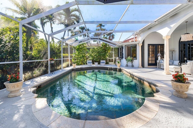 view of pool featuring a lanai and a patio