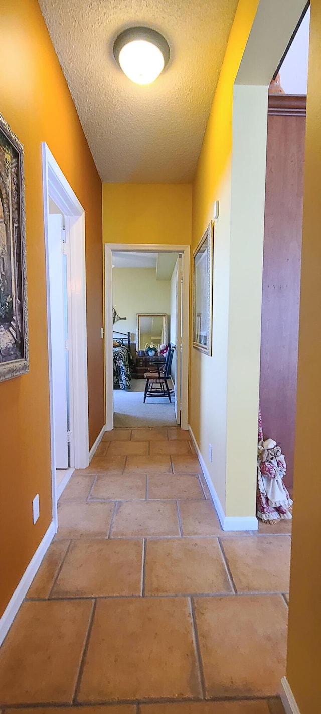 corridor with a textured ceiling