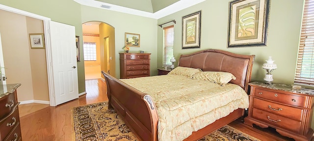 bedroom with hardwood / wood-style flooring