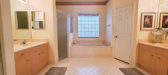 bathroom with separate shower and tub, tile patterned floors, and vanity