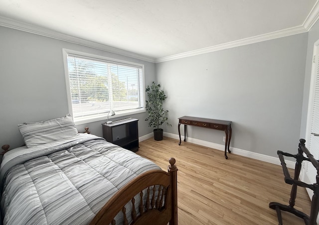 bedroom featuring light hardwood / wood-style floors and ornamental molding