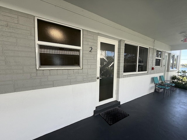 property entrance featuring covered porch