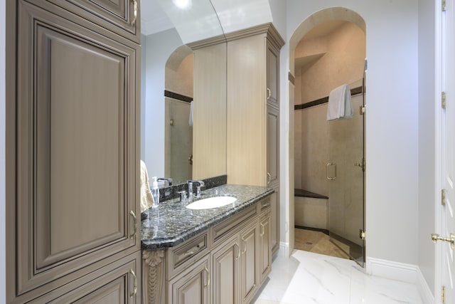 bathroom featuring vanity and walk in shower