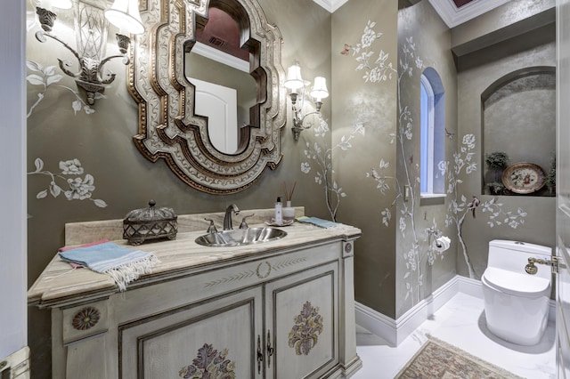 bathroom featuring vanity, toilet, and crown molding