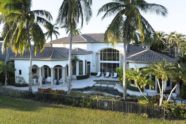 rear view of house with a patio