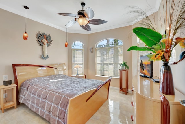 bedroom featuring ceiling fan, ornamental molding, and light tile patterned floors