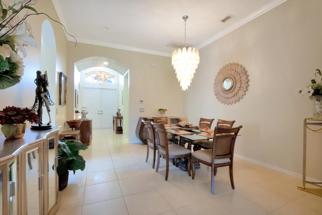 tiled dining room with crown molding and a notable chandelier